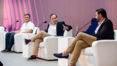 Group of men sitting in a conference