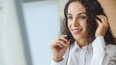 A woman in a headset taking a call