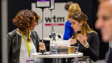 two man talking at the wtm london event