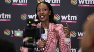 woman standing in the media wall