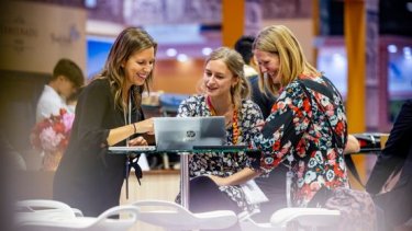 women laughing at the wtm event