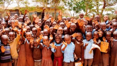 happy children waving a hand