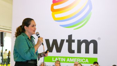 Woman talking in WTM Latin America