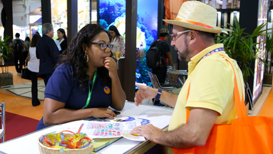 Man and a woman talking at WTM Latin America